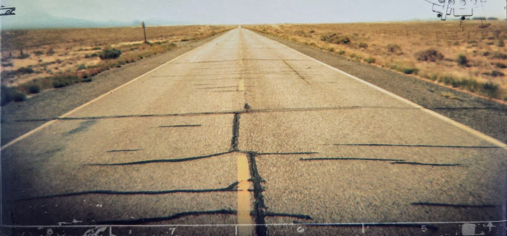 A road stretching into a desert landscape
